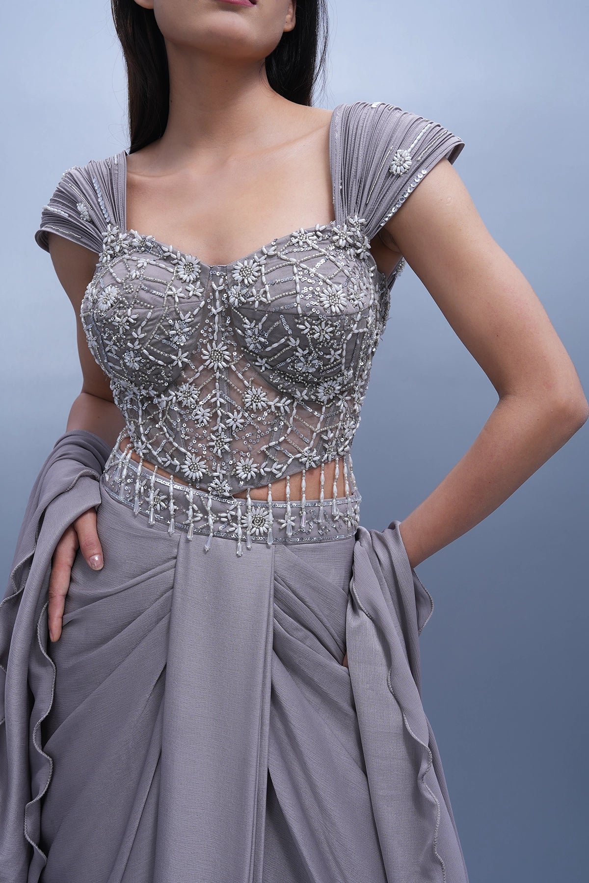 Lilac draped skirt set with embroidered wired blouse and ruffle dupatta