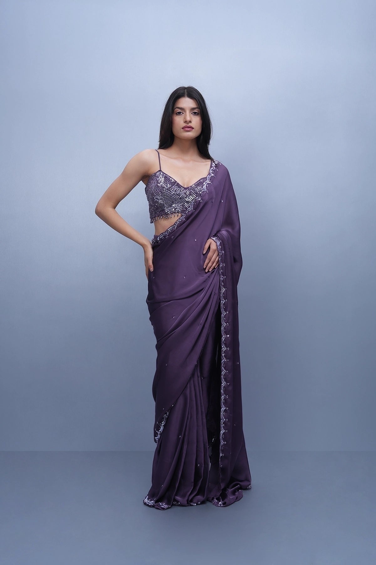 Violet satin saree with a spaghetti blouse