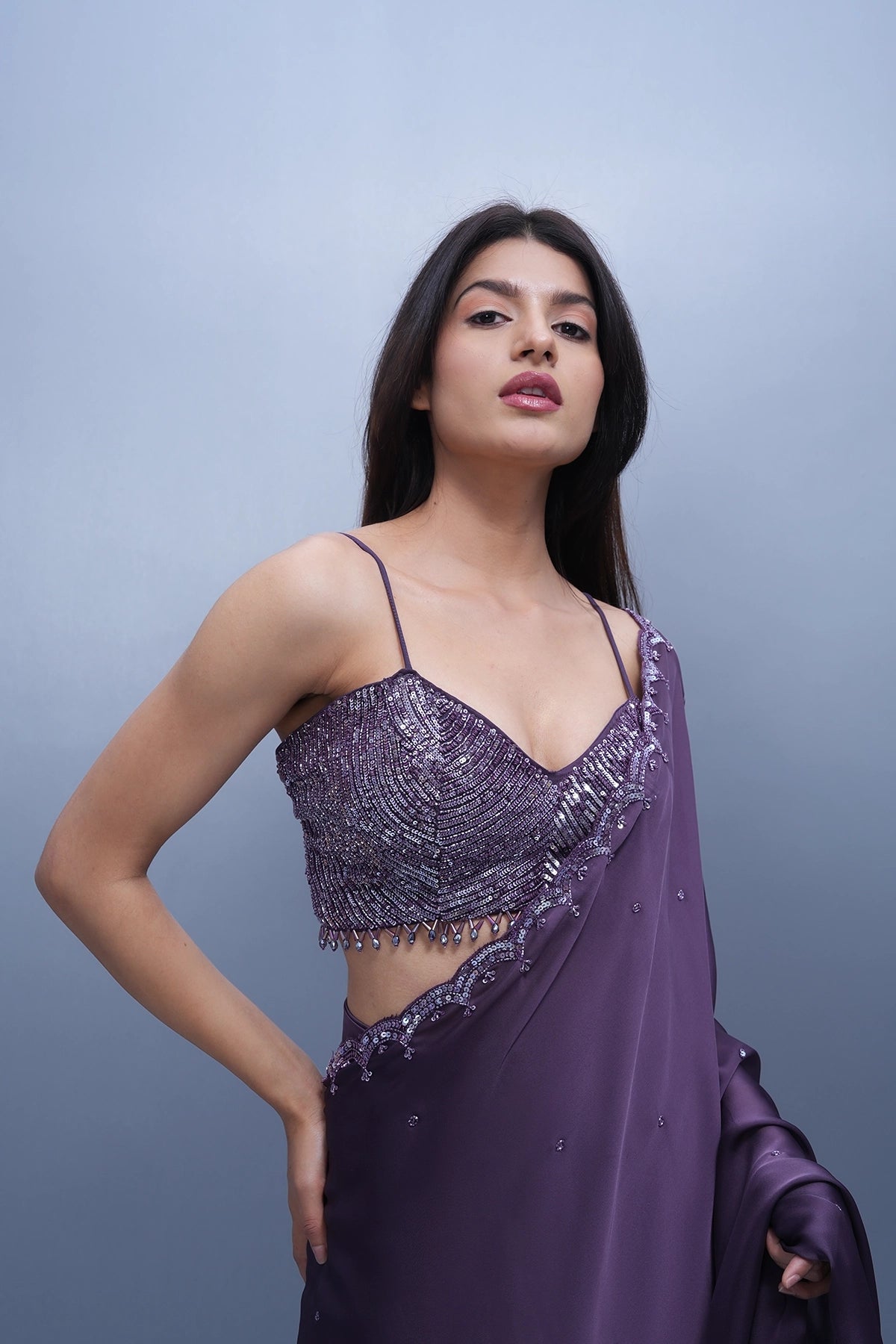 Violet satin saree with a spaghetti blouse