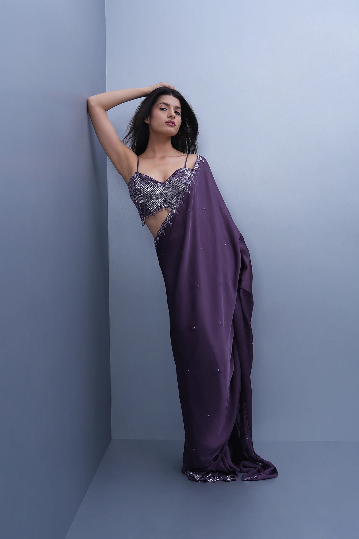 Violet satin saree with a spaghetti blouse
