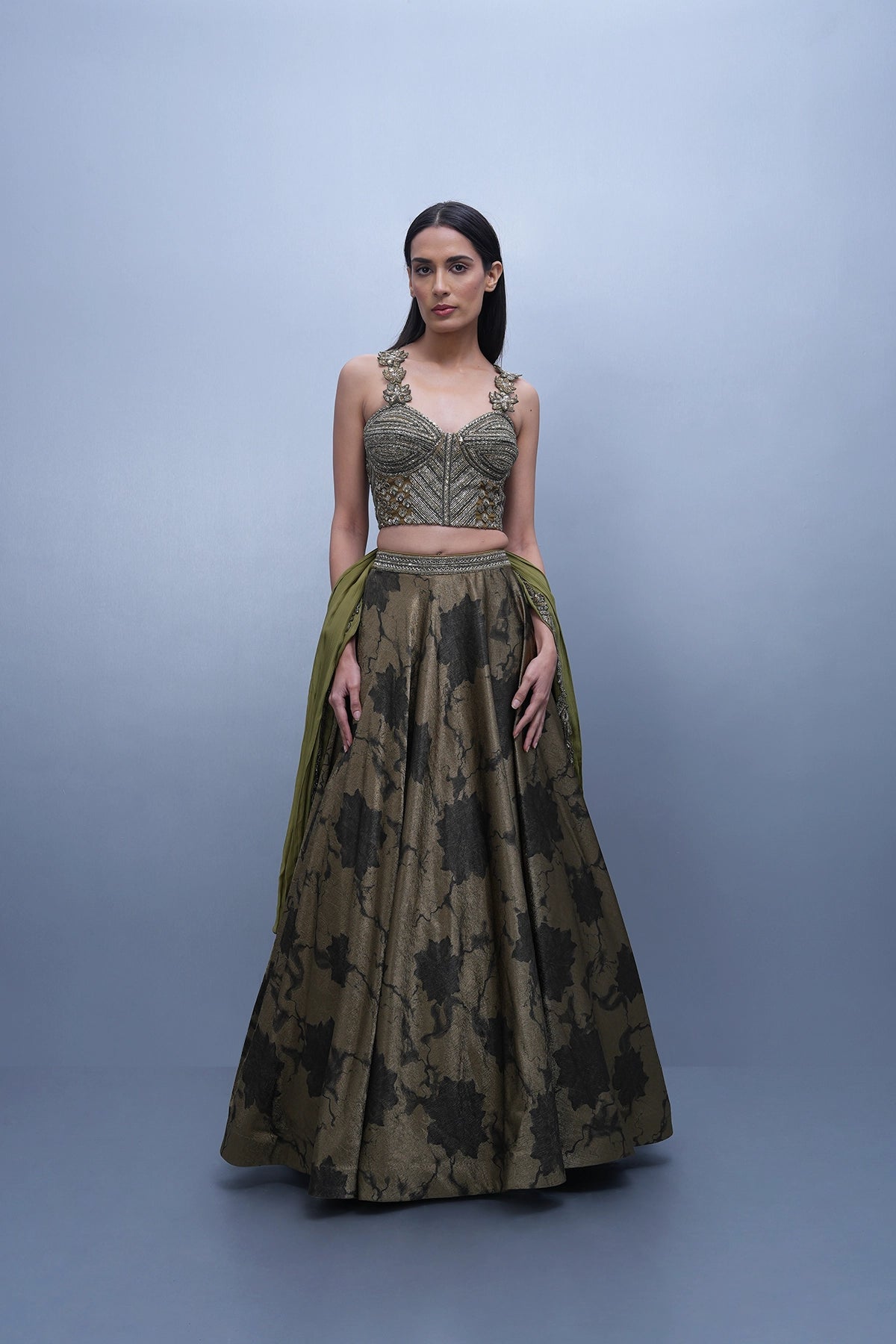 Dark olive green printed lehenga with a corset style blouse