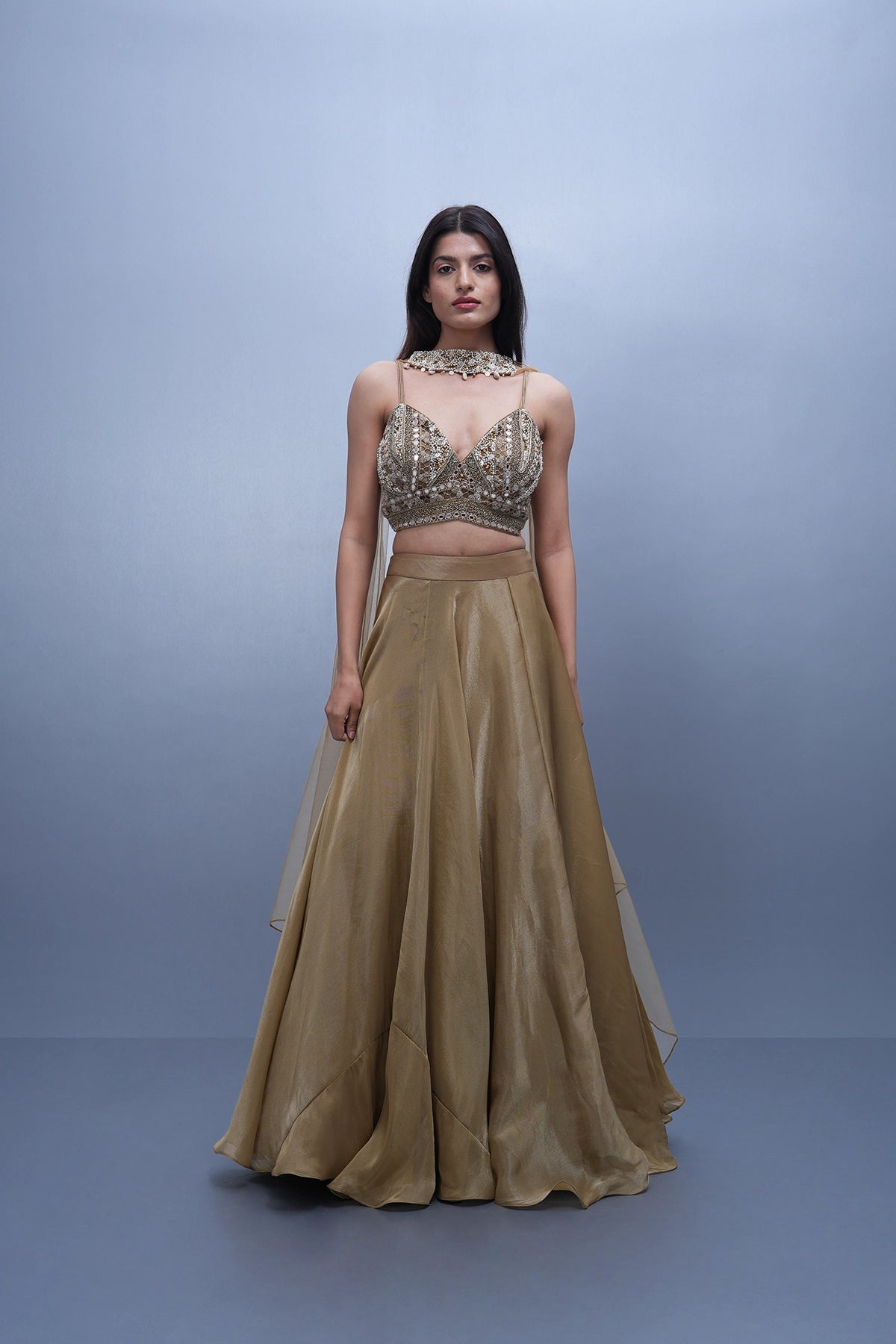 Gold lehenga in tissue with spaghetti blouse and choker dupatta