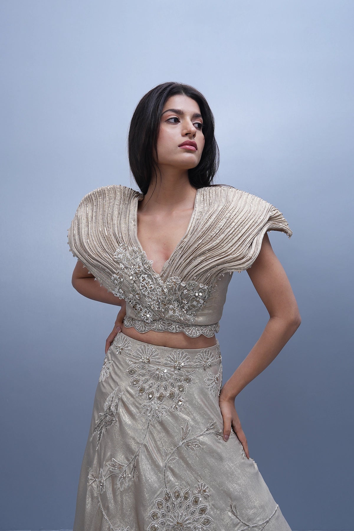 Ivory gold shine lehenga with dramatic wired blouse