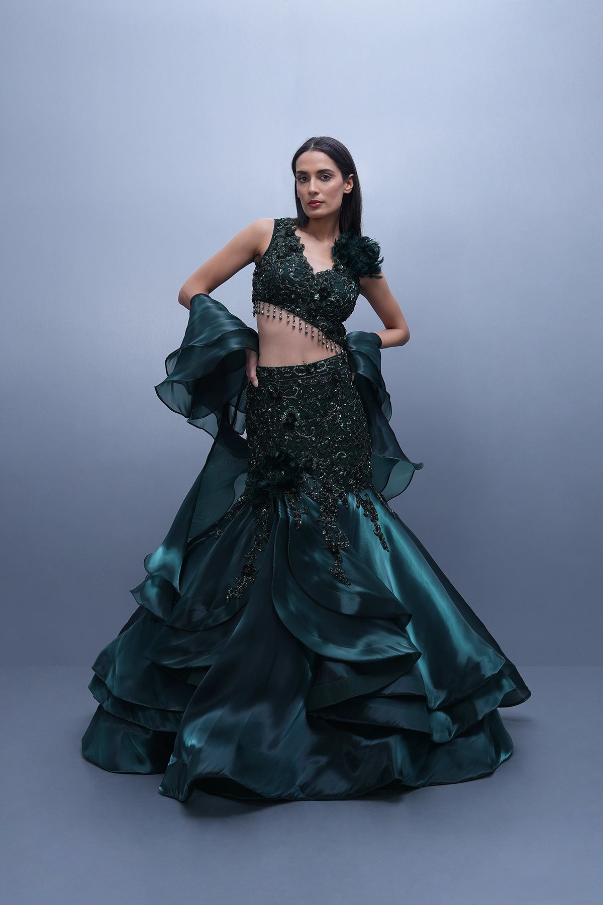 Bottle green fishcut lehenga with assymetric hem top and ruffle dupatta set