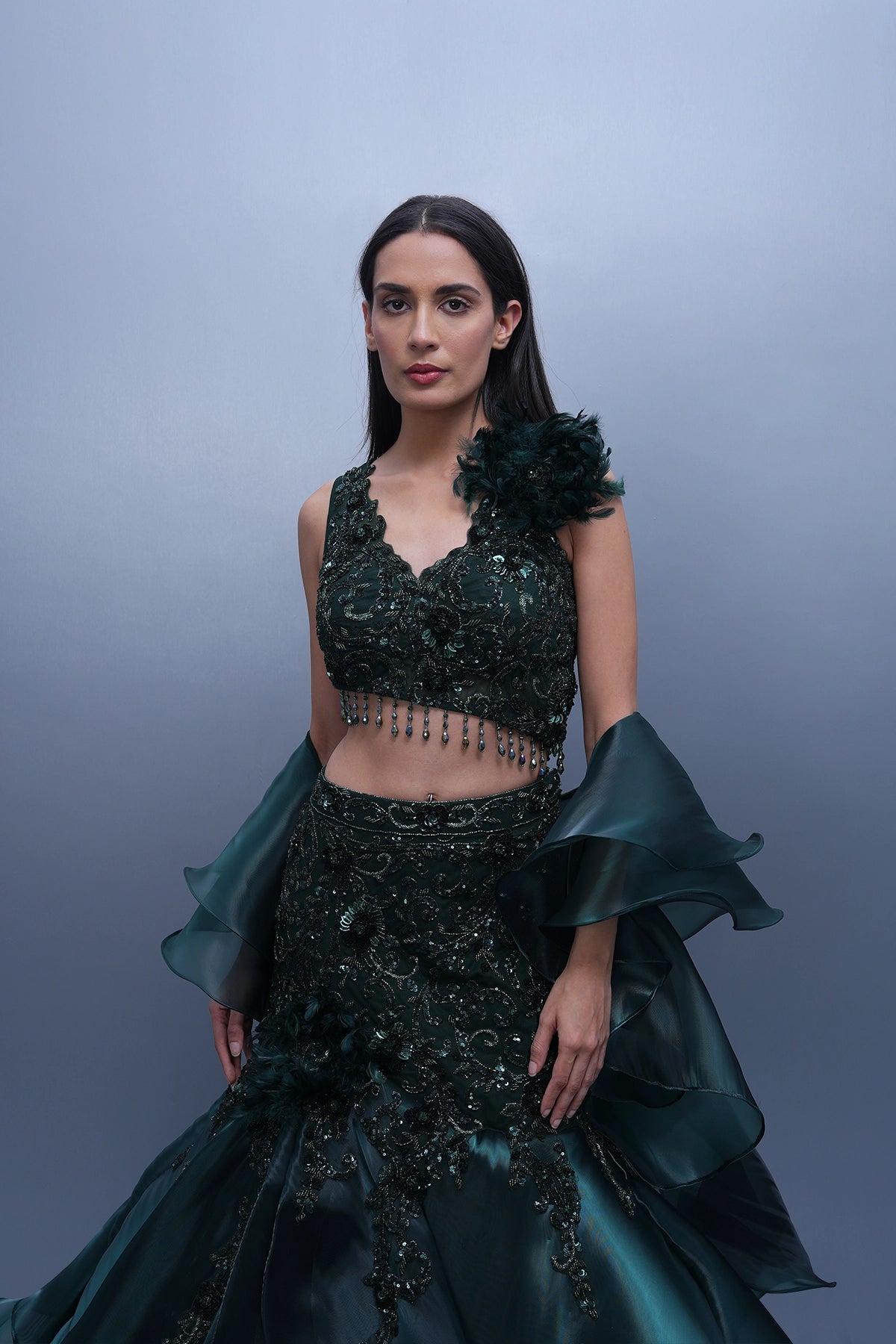 Bottle green fishcut lehenga with assymetric hem top and ruffle dupatta set