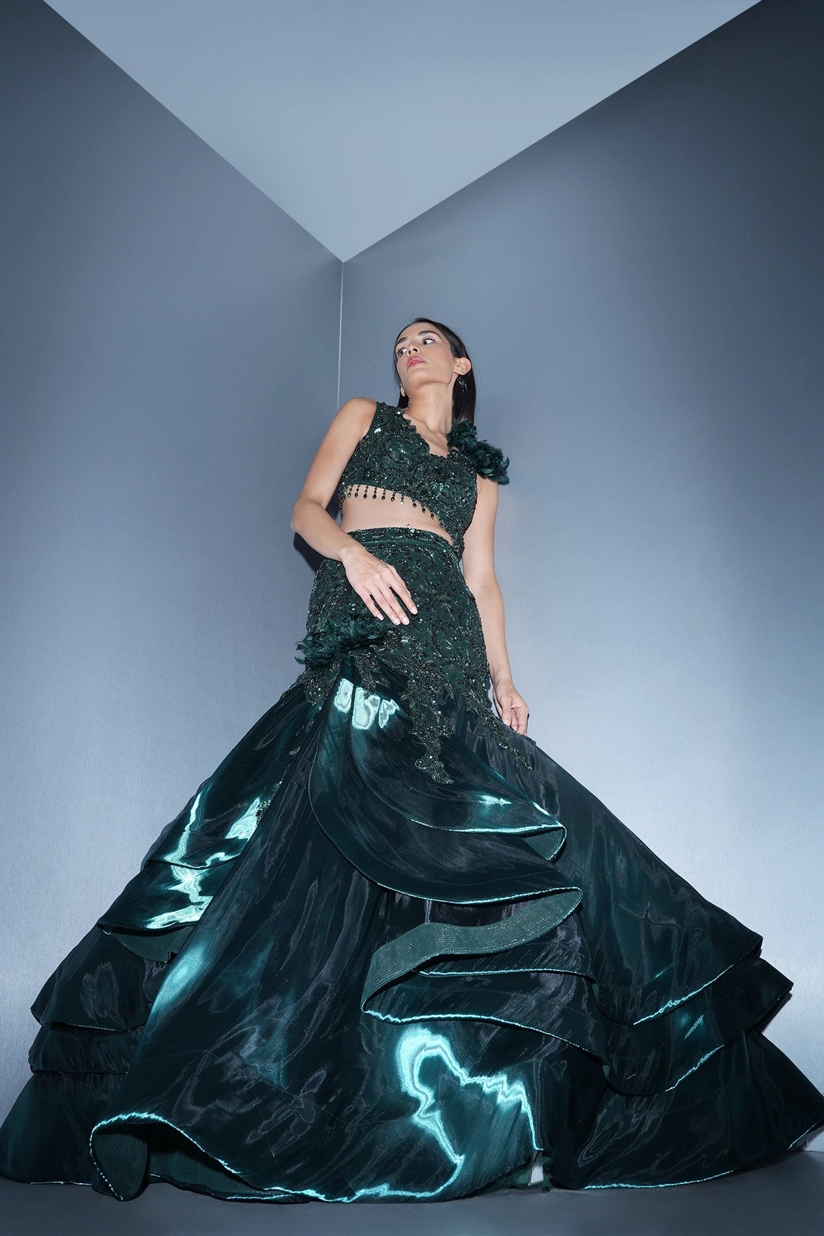 Bottle green fishcut lehenga with assymetric hem top and ruffle dupatta set