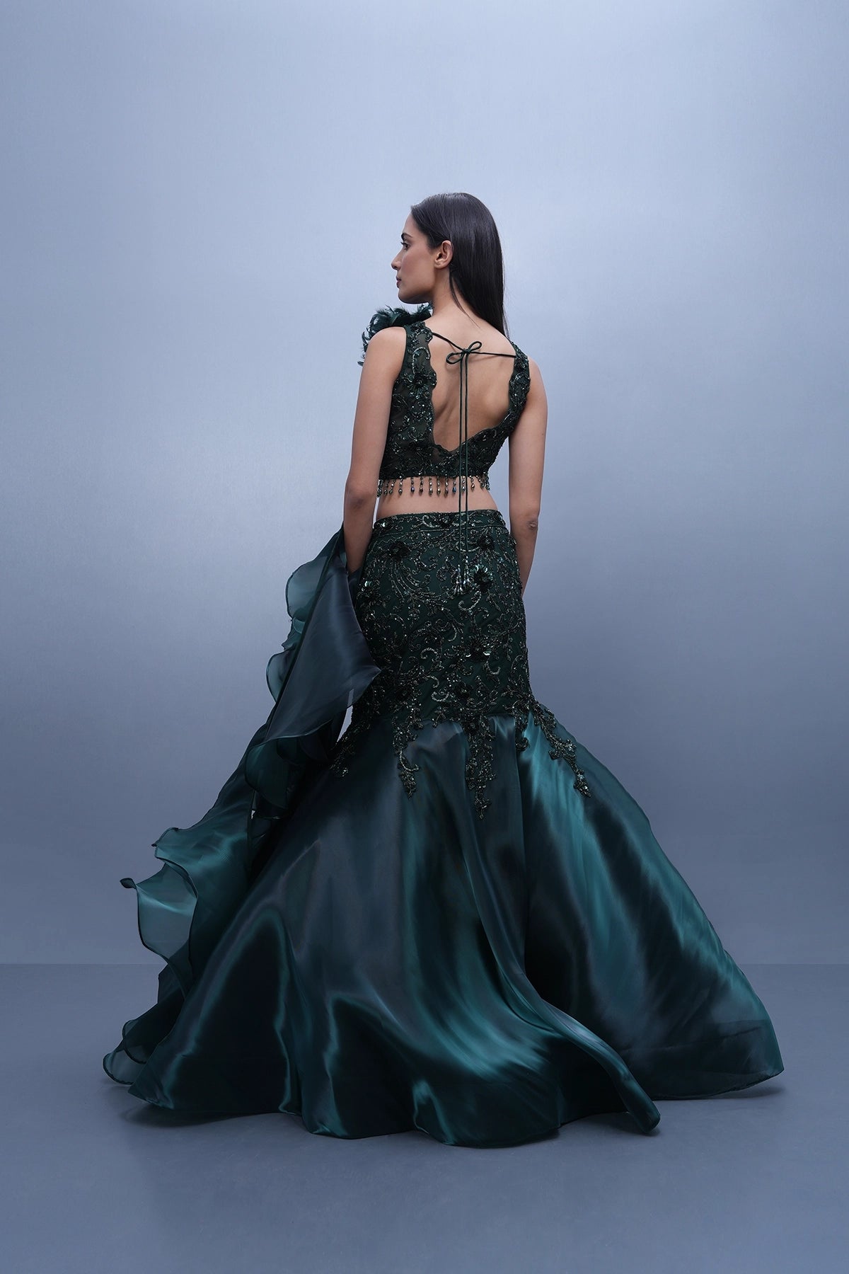 Bottle green fishcut lehenga with assymetric hem top and ruffle dupatta set