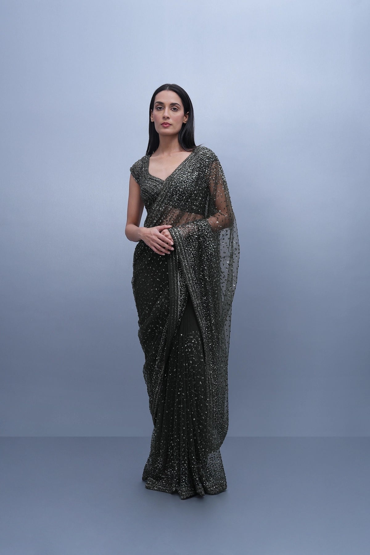 Dark olive green embroidered saree in net and blouse set