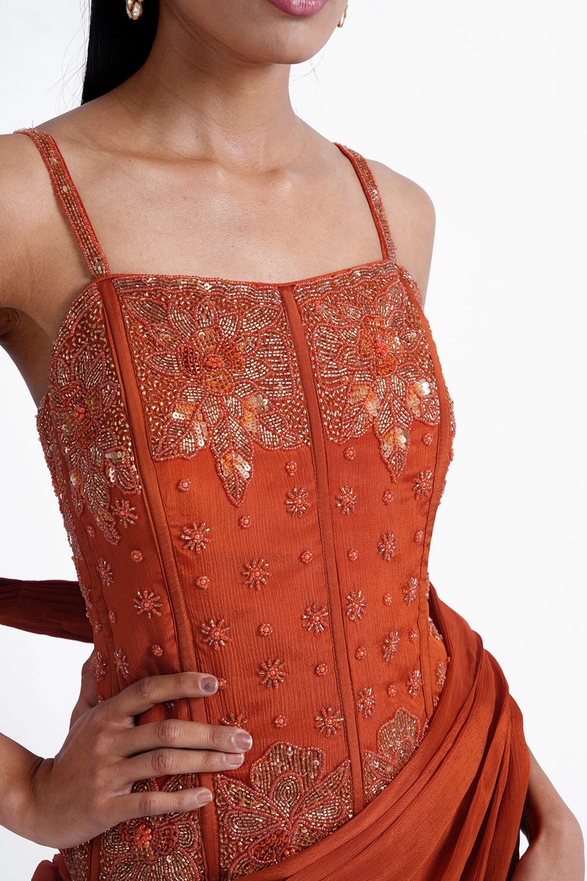Rust orange palazzo saree paired with a long corset top