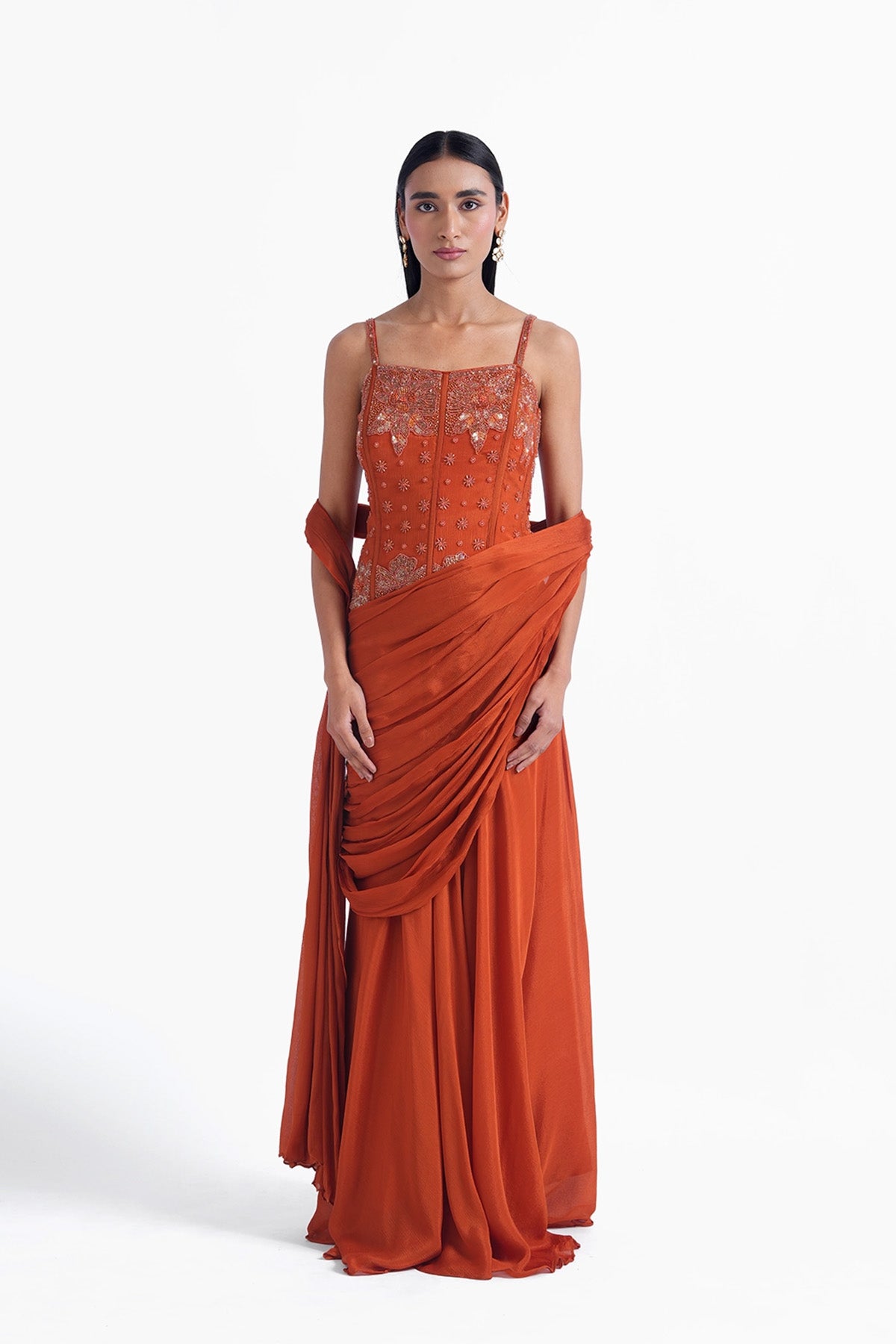 Rust orange palazzo saree paired with a long corset top