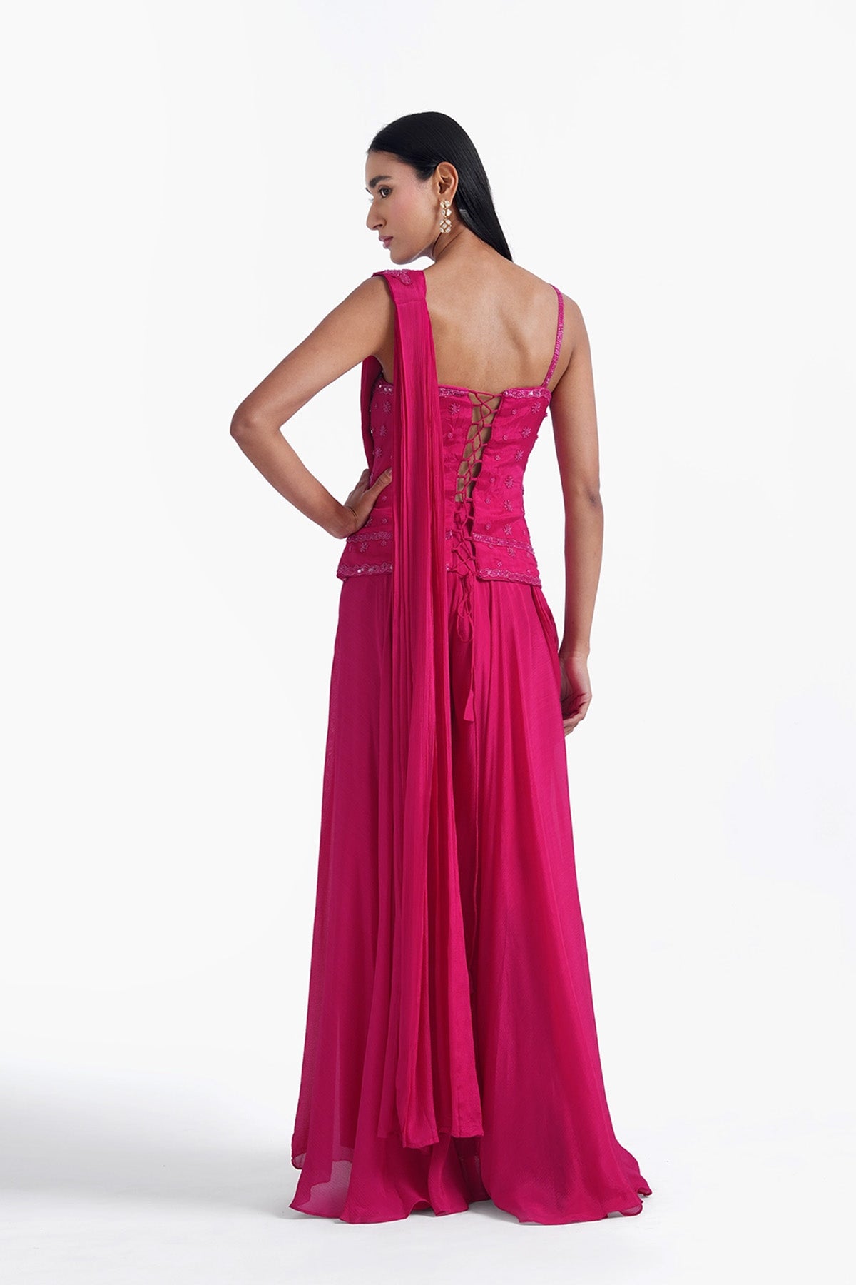 rani pink palazzo saree paired with a long corset top