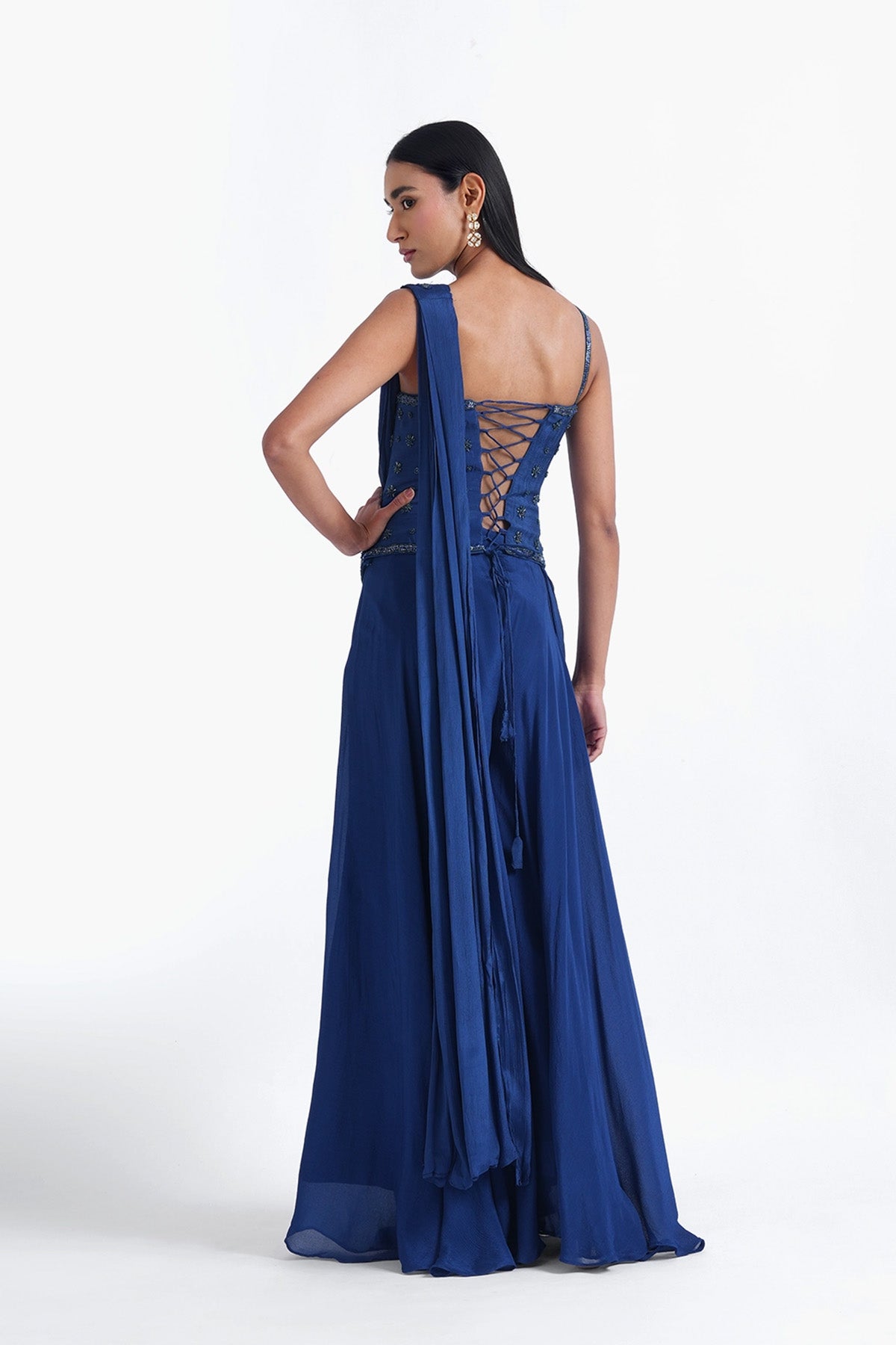 Persian blue palazzo saree paired with a long corset top