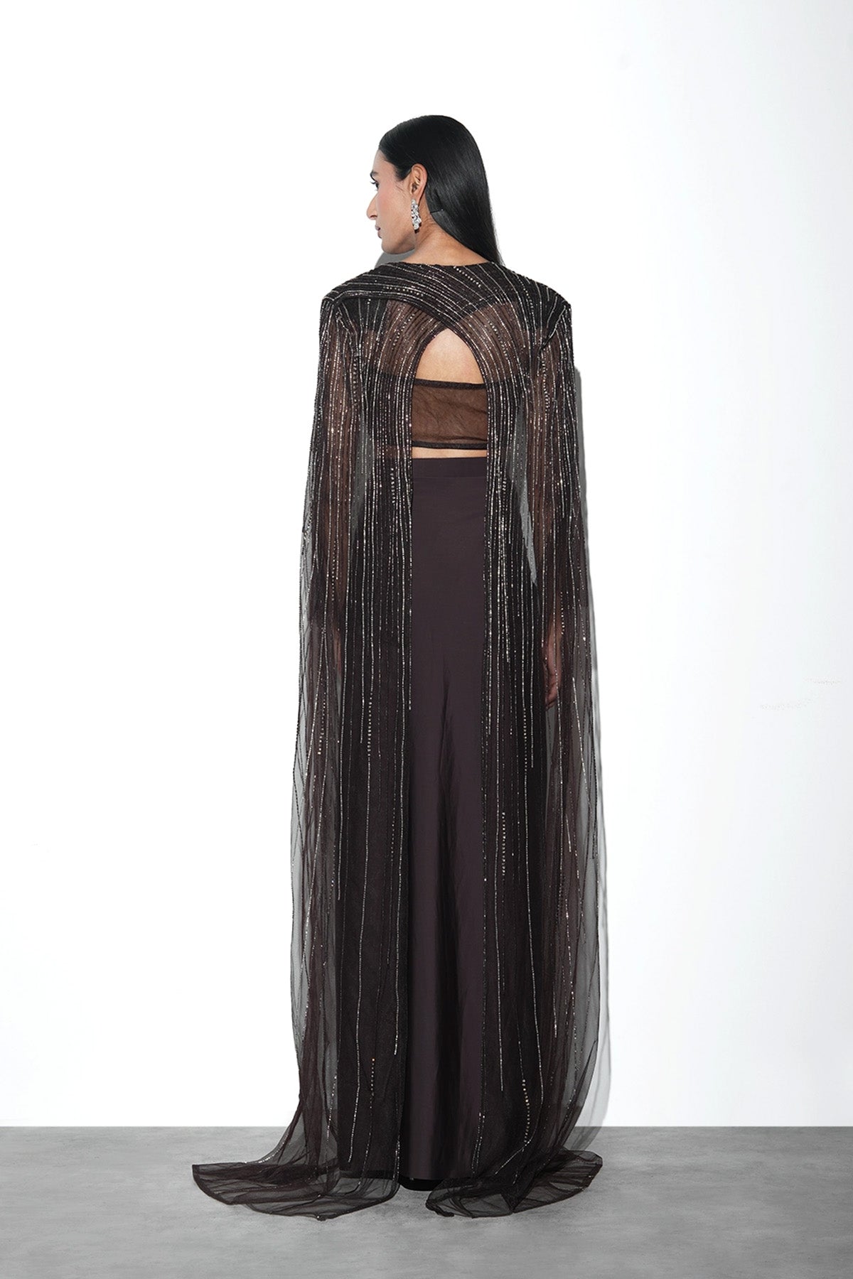 brown draped skirt with power shoulder cape and top set