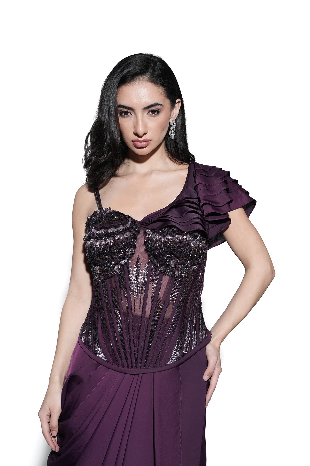 Magenta corset blouse with 3D applique and ruffles paired with draped skirt set
