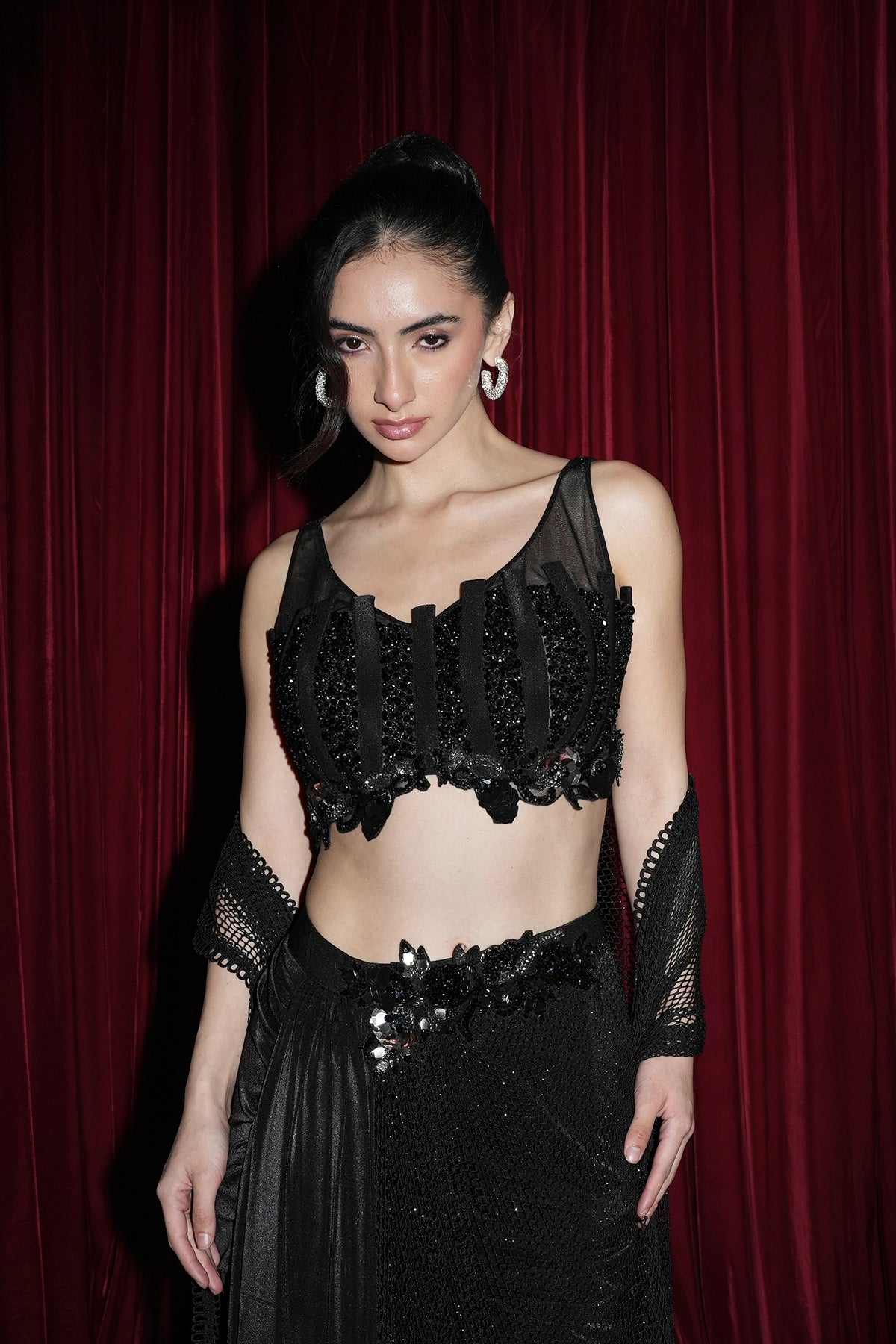 black pre-draped saree with fishnet style pallu and embroidered blouse