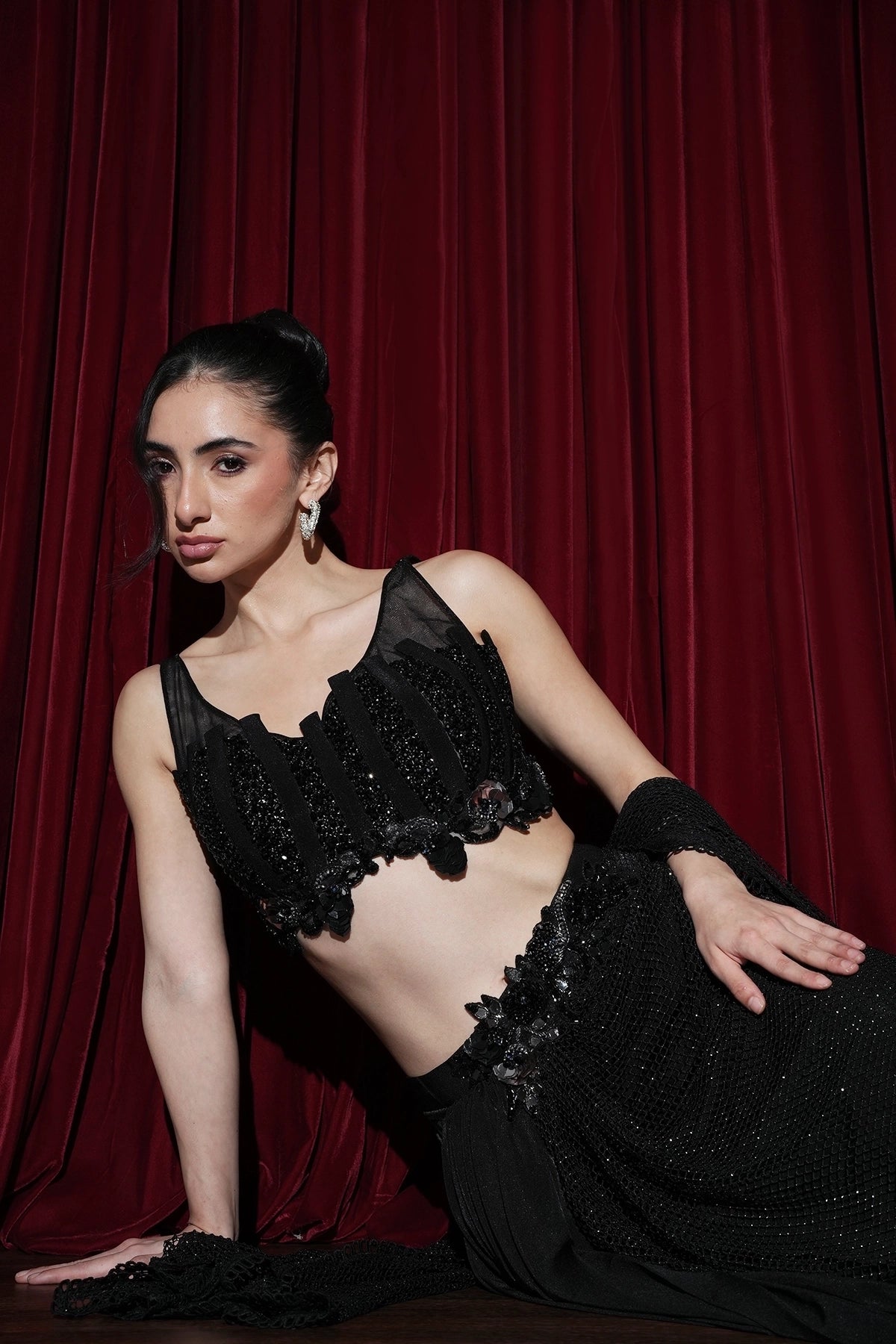 black pre-draped saree with fishnet style pallu and embroidered blouse