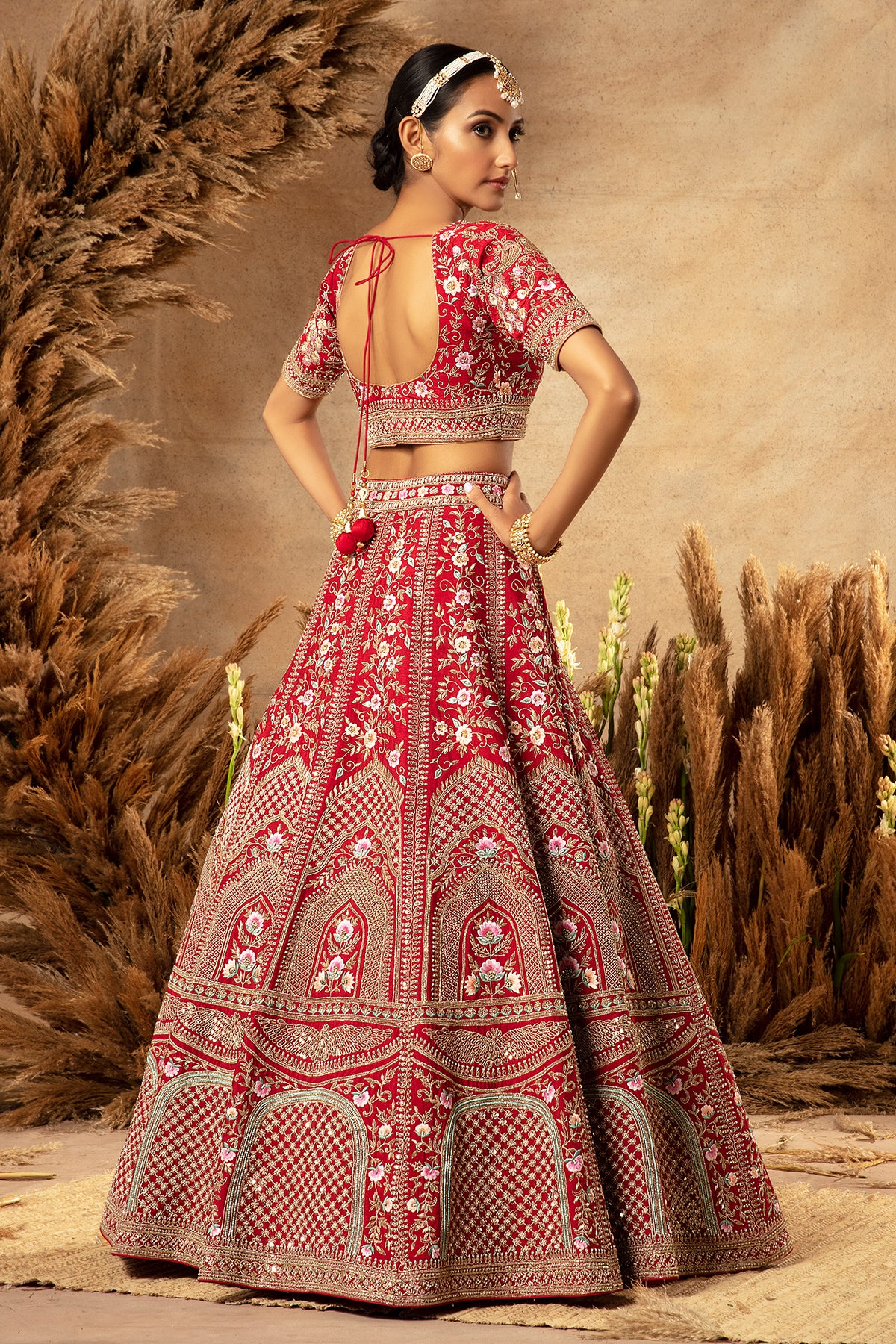 Panihari-Crimson Red Hand Erbroidered Bridal Lehenga in Raw Silk