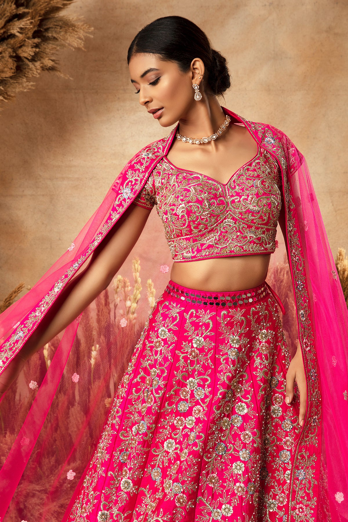 Panihari-Fuchsia Pink Bridal Lehenga in Raw Silk With Heavy Embroidery and Mirror Work Border