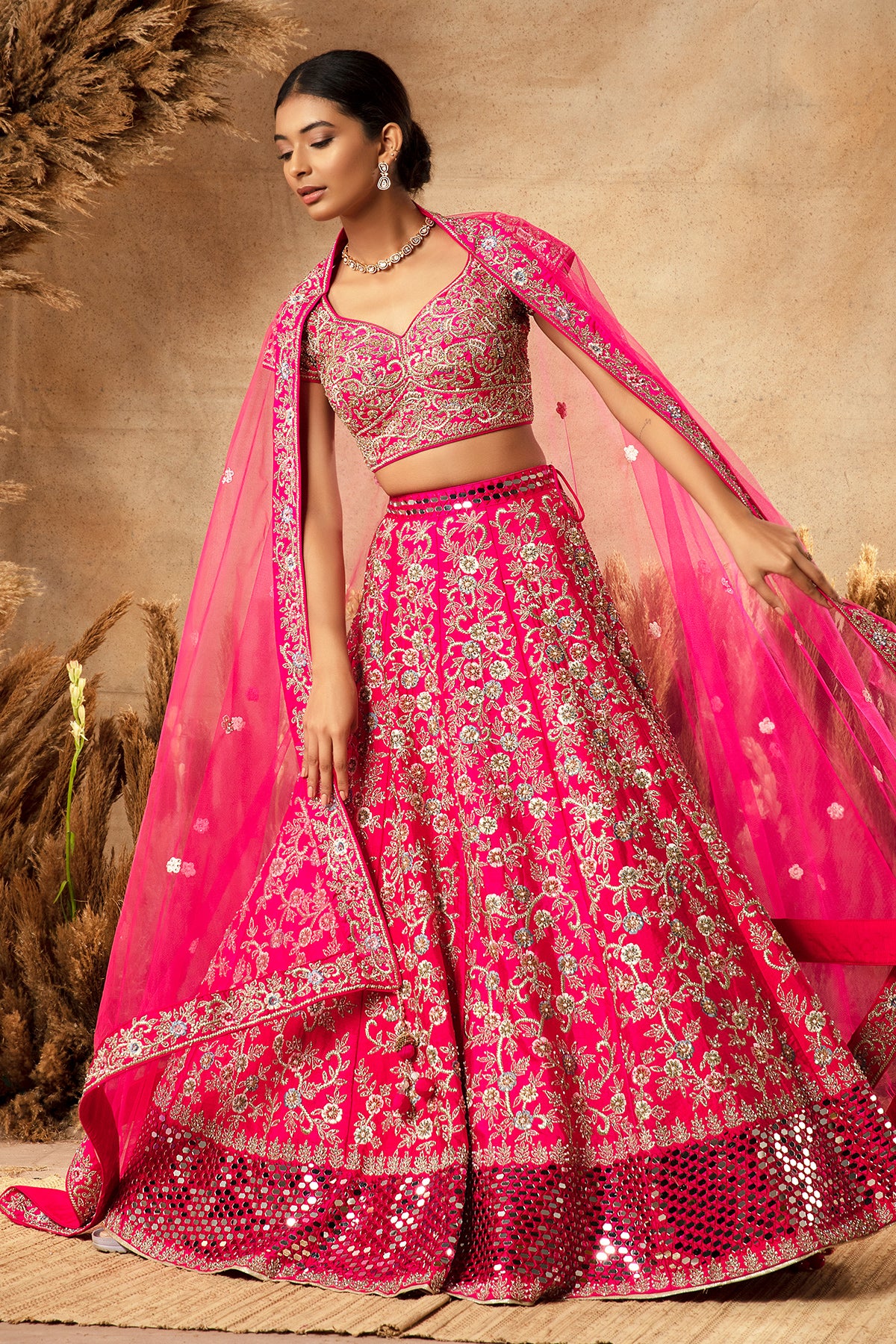 Panihari-Fuchsia Pink Bridal Lehenga in Raw Silk With Heavy Embroidery and Mirror-Work Border