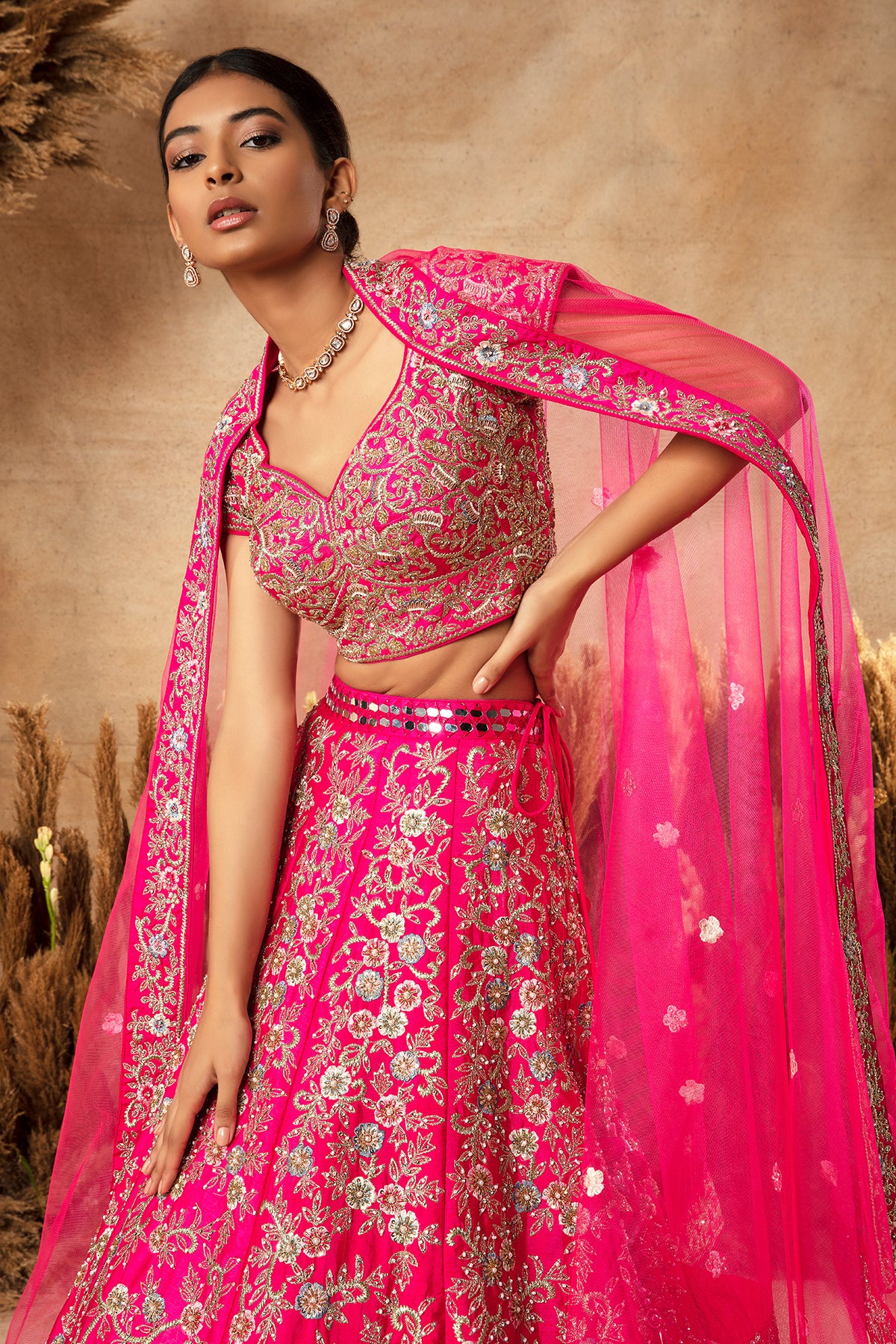 Panihari-Fuchsia Pink Bridal Lehenga in Raw Silk With Heavy Embroidery and Mirror Work Border