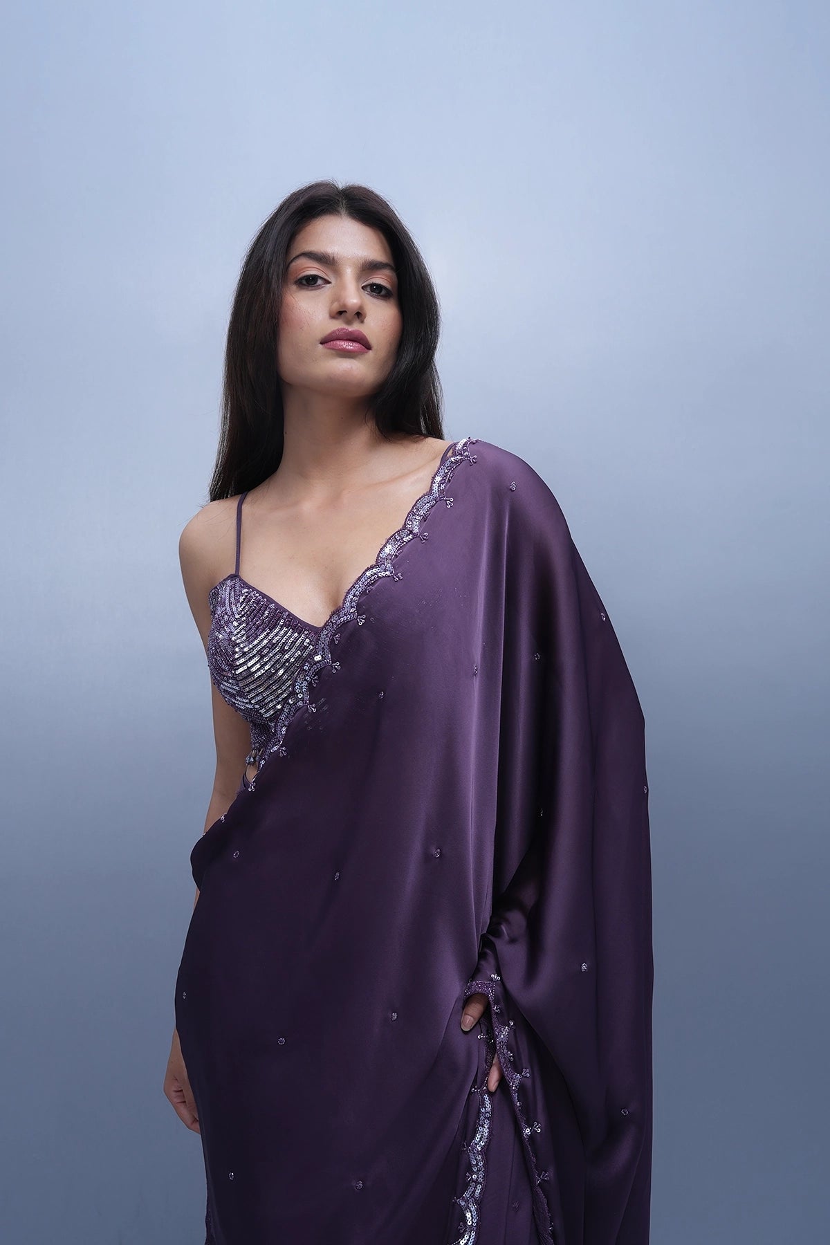 Violet satin saree with a spaghetti blouse
