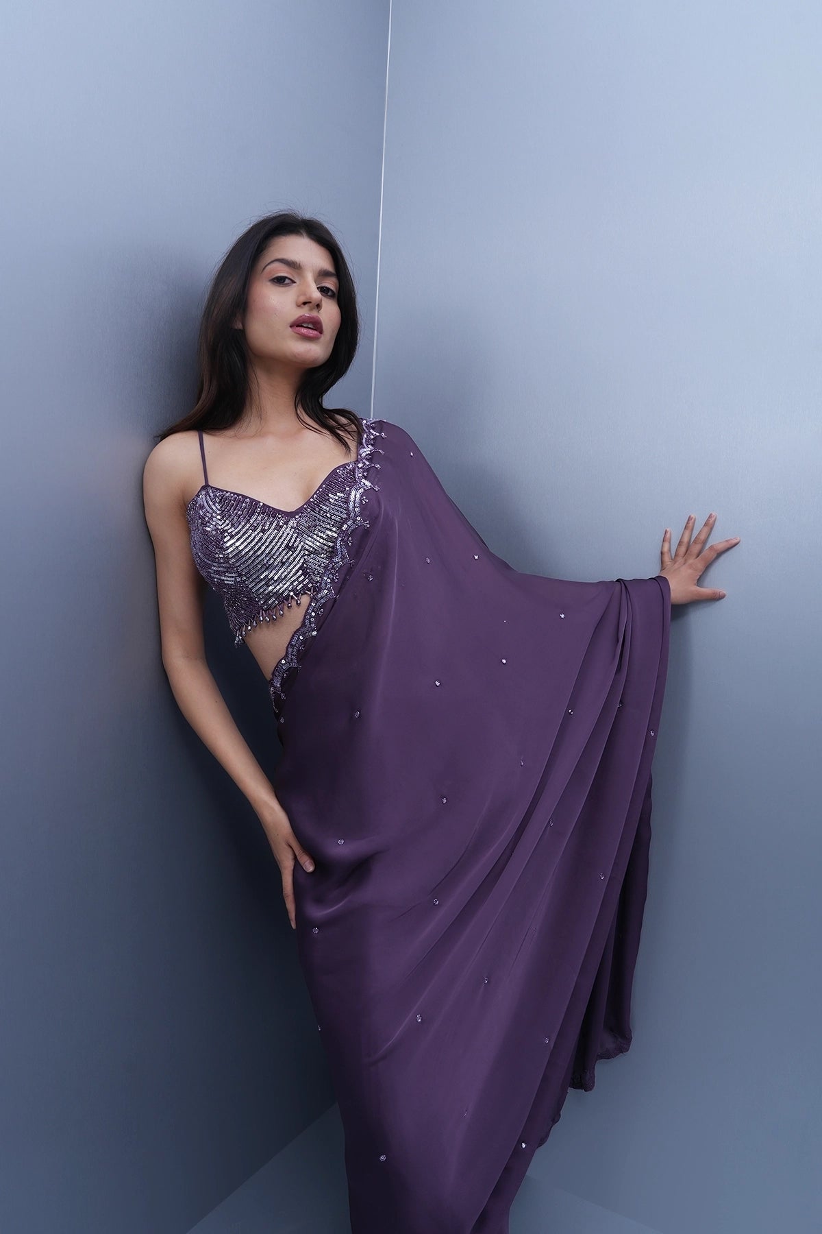 Violet satin saree with a spaghetti blouse