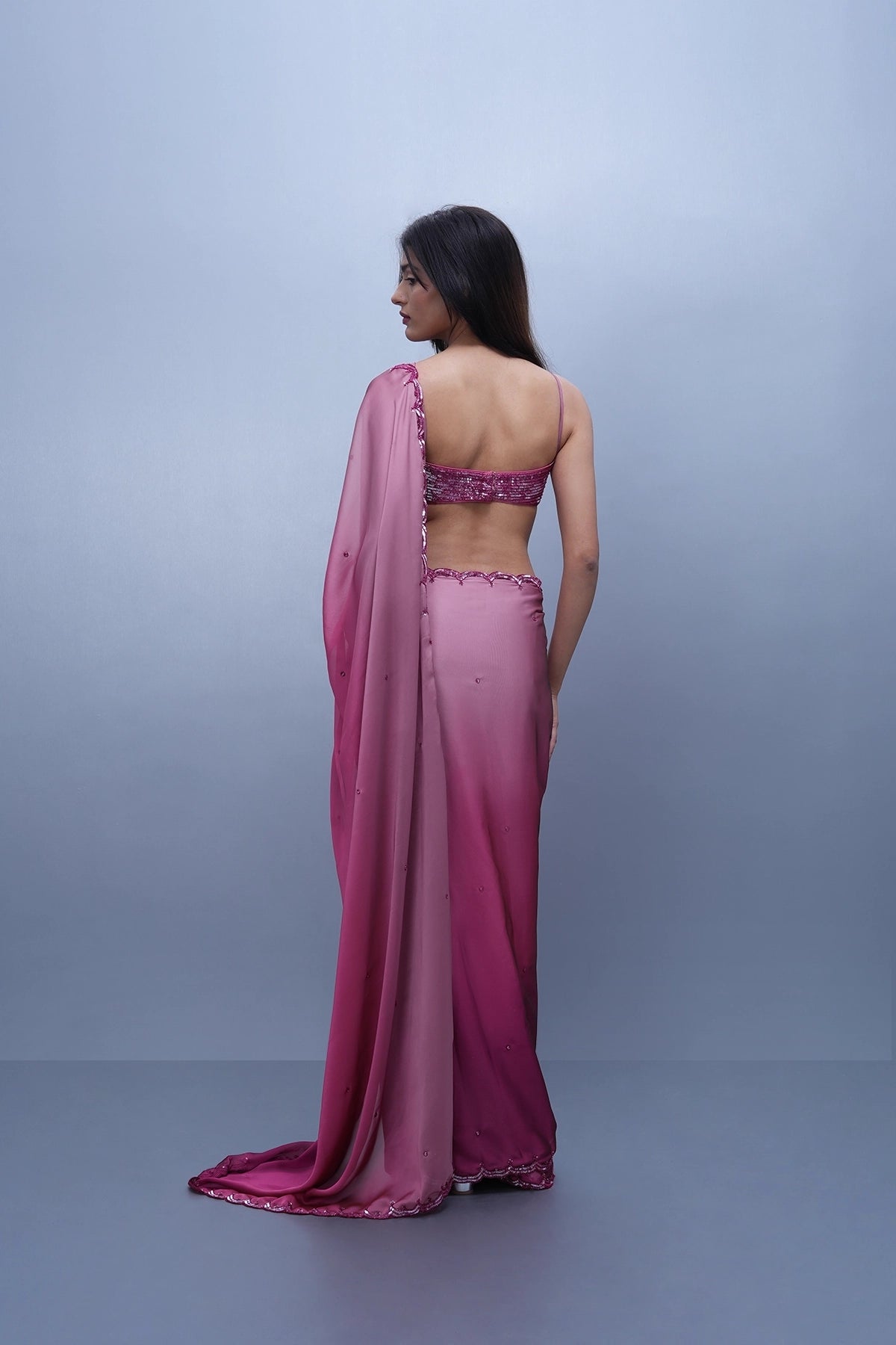 Pink shaded satin saree with a spaghetti blouse