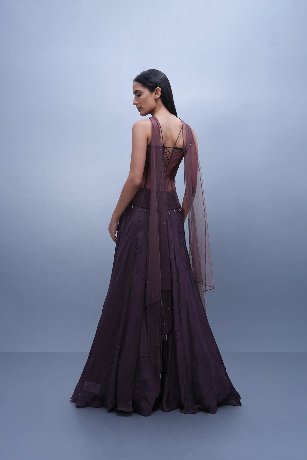 Dark mauve lehenga with a long corset top and choker dupatta