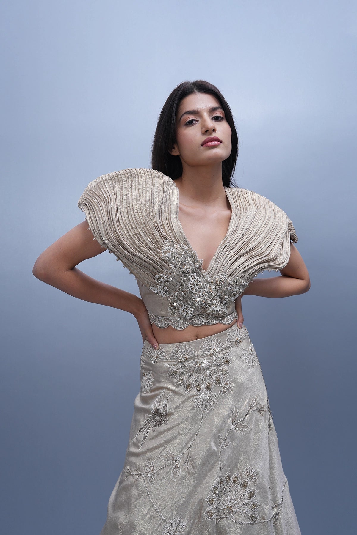 Ivory gold shine lehenga with dramatic wired blouse