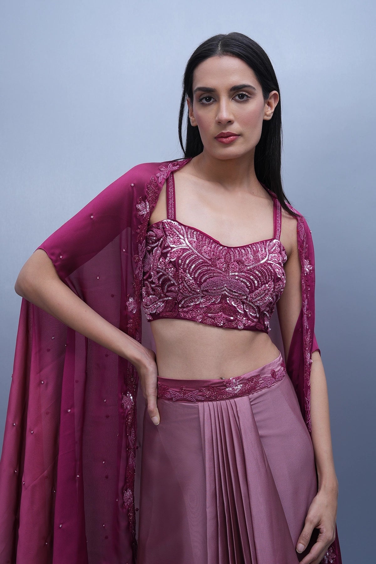 Rani Pink shaded draped skirt set with hand embroidered blouse and cape