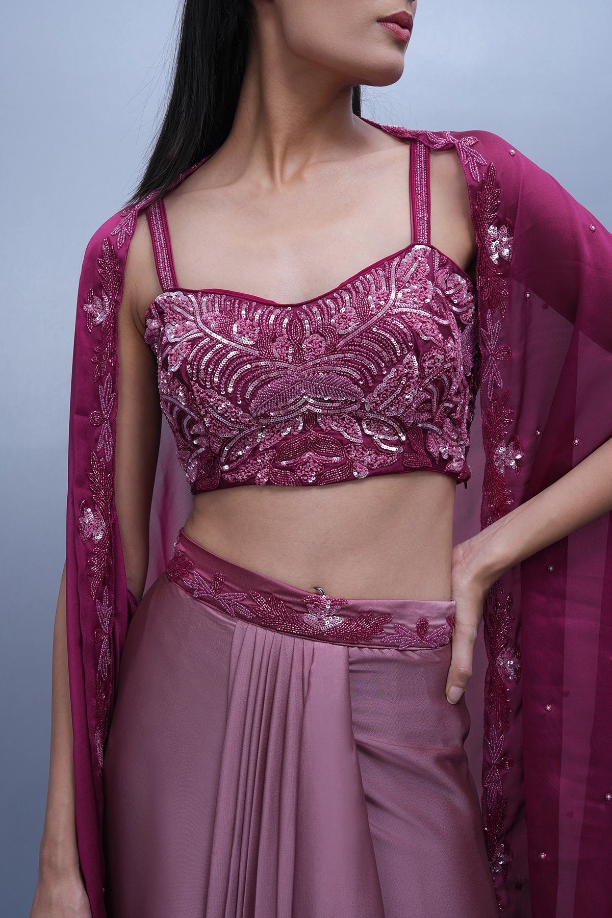 Rani Pink shaded draped skirt set with hand embroidered blouse and cape