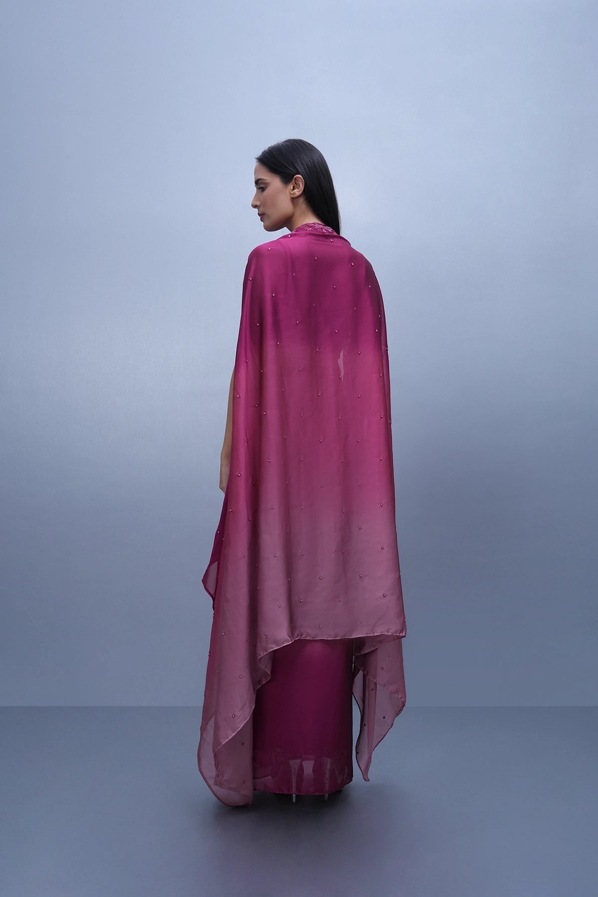 Rani Pink shaded draped skirt set with hand embroidered blouse and cape