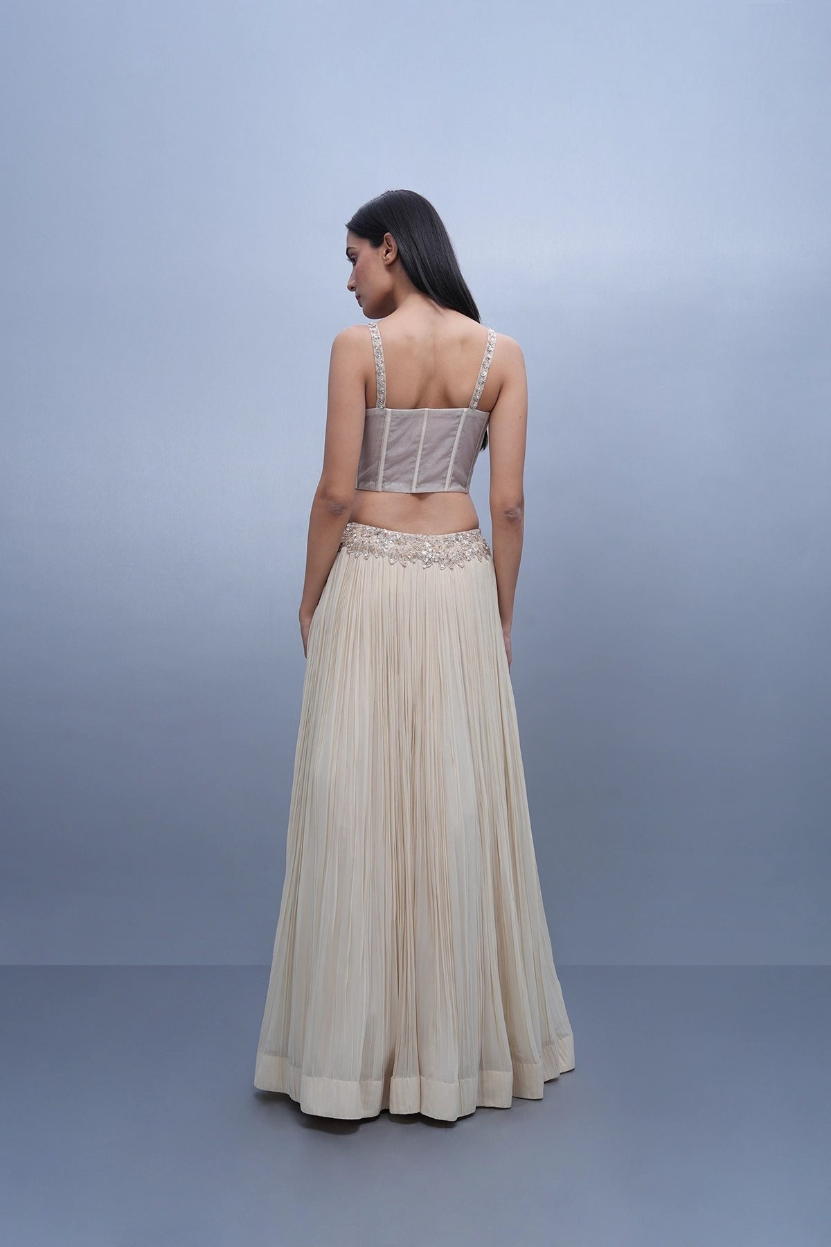 Ivory lehenga set in georgette with hand embroidered assymetric hem blouse