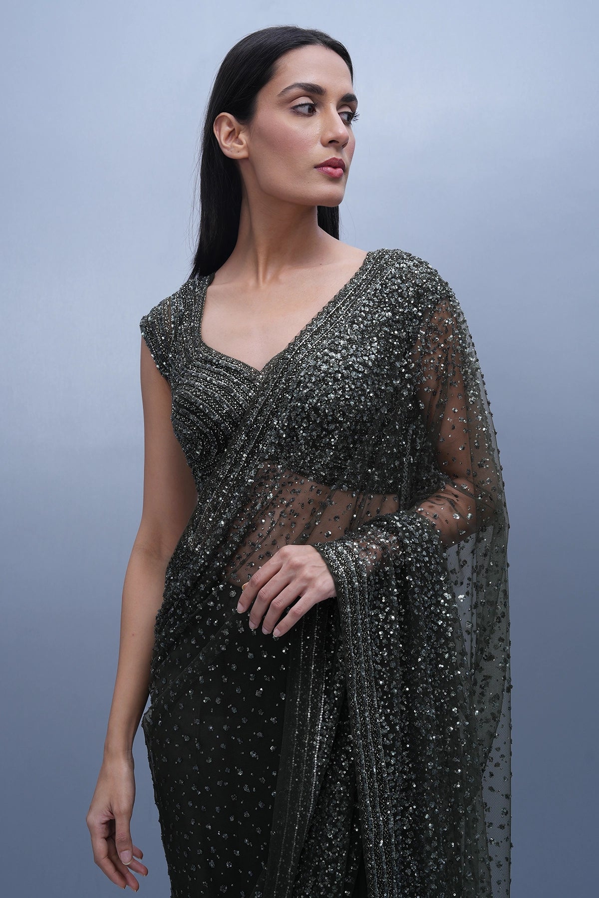 Dark olive green embroidered saree in net and blouse set