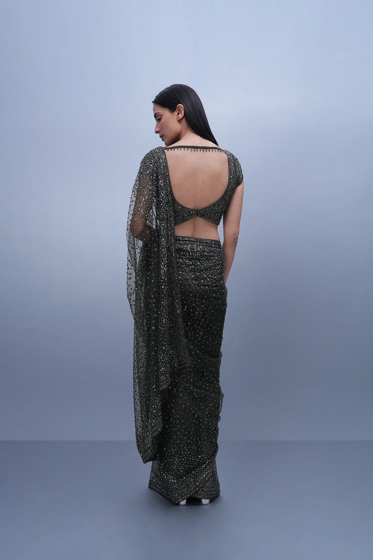 Dark olive green embroidered saree in net and blouse set