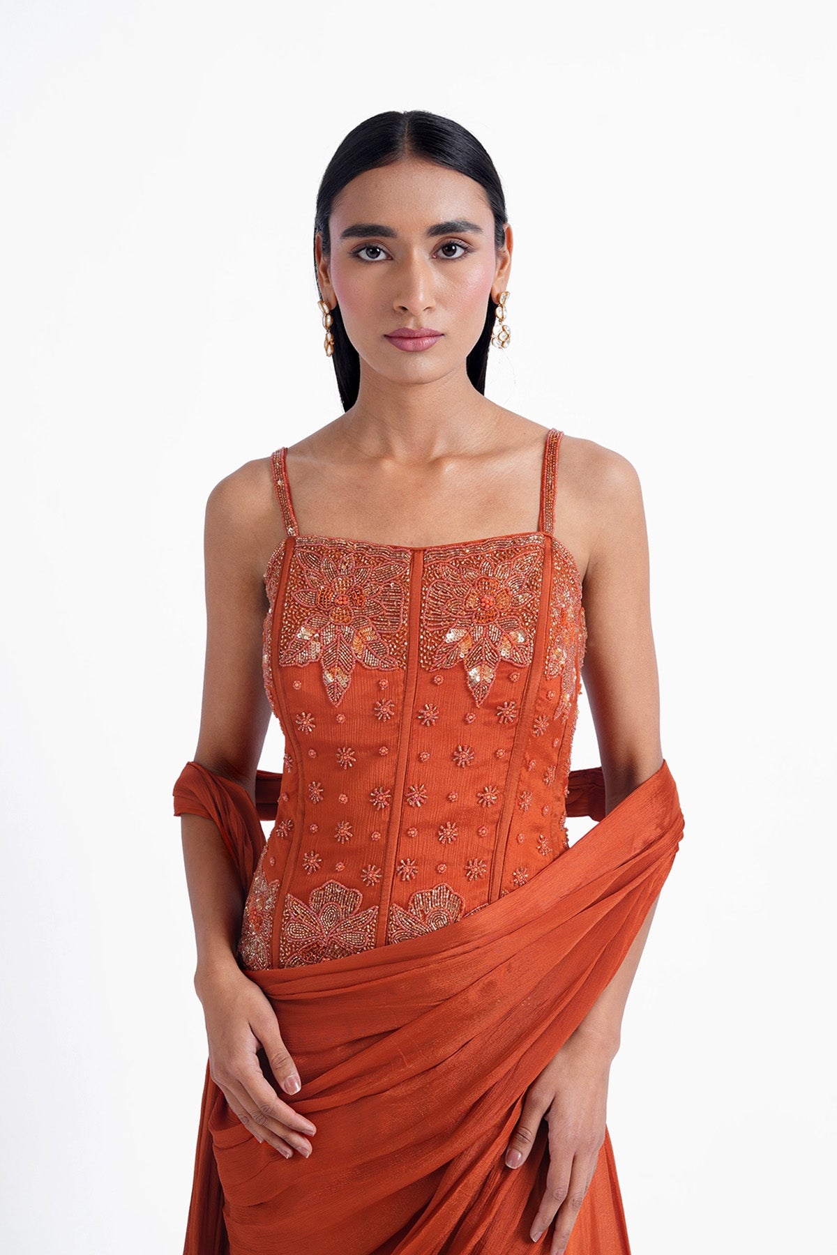Rust orange palazzo saree paired with a long corset top