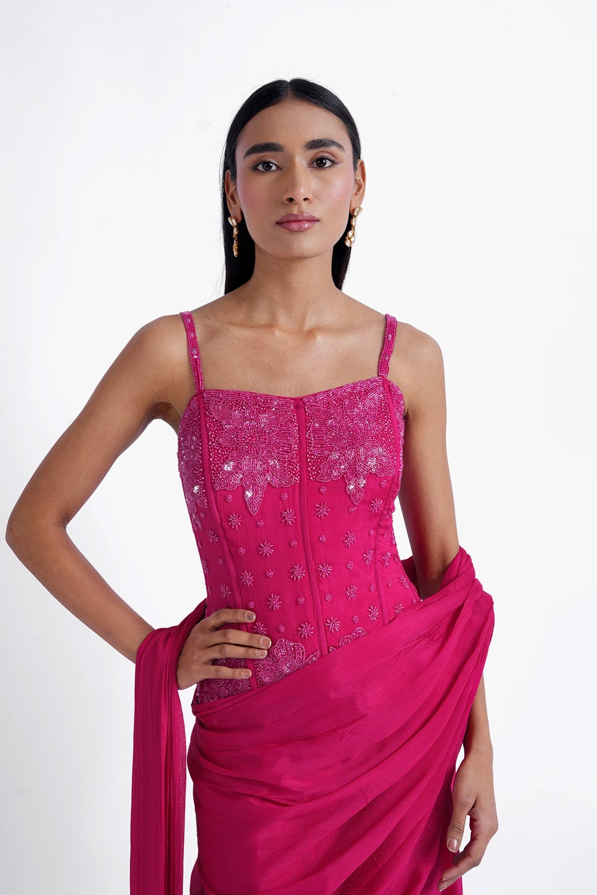 rani pink palazzo saree paired with a long corset top