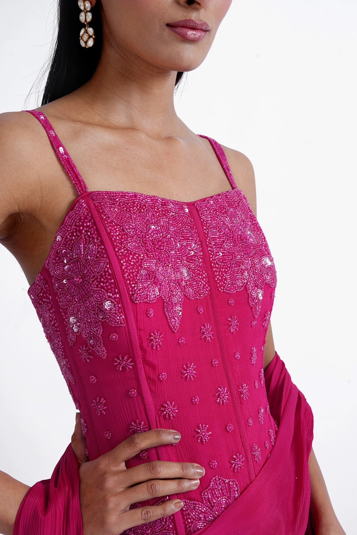rani pink palazzo saree paired with a long corset top