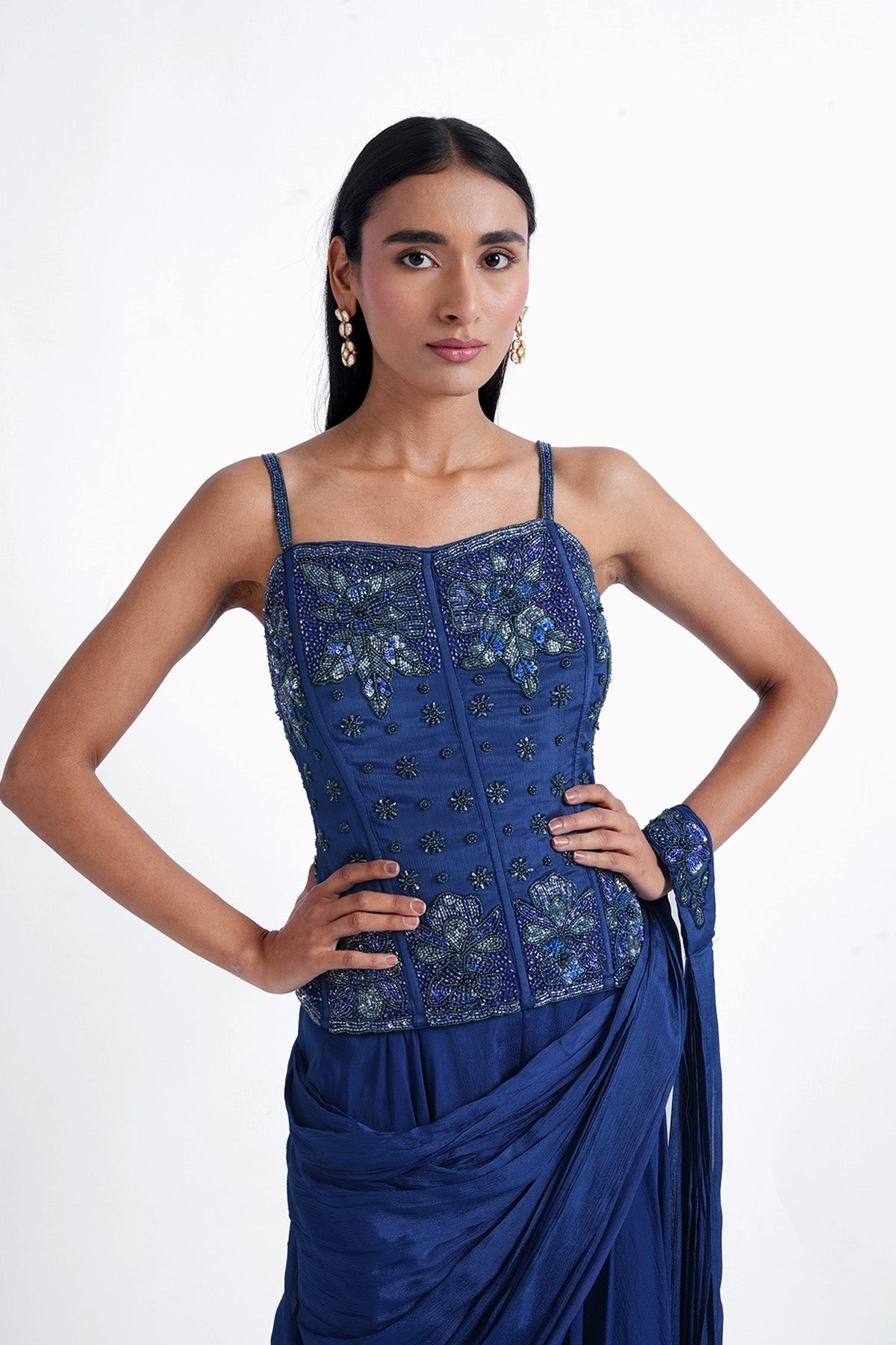 Persian blue palazzo saree paired with a long corset top