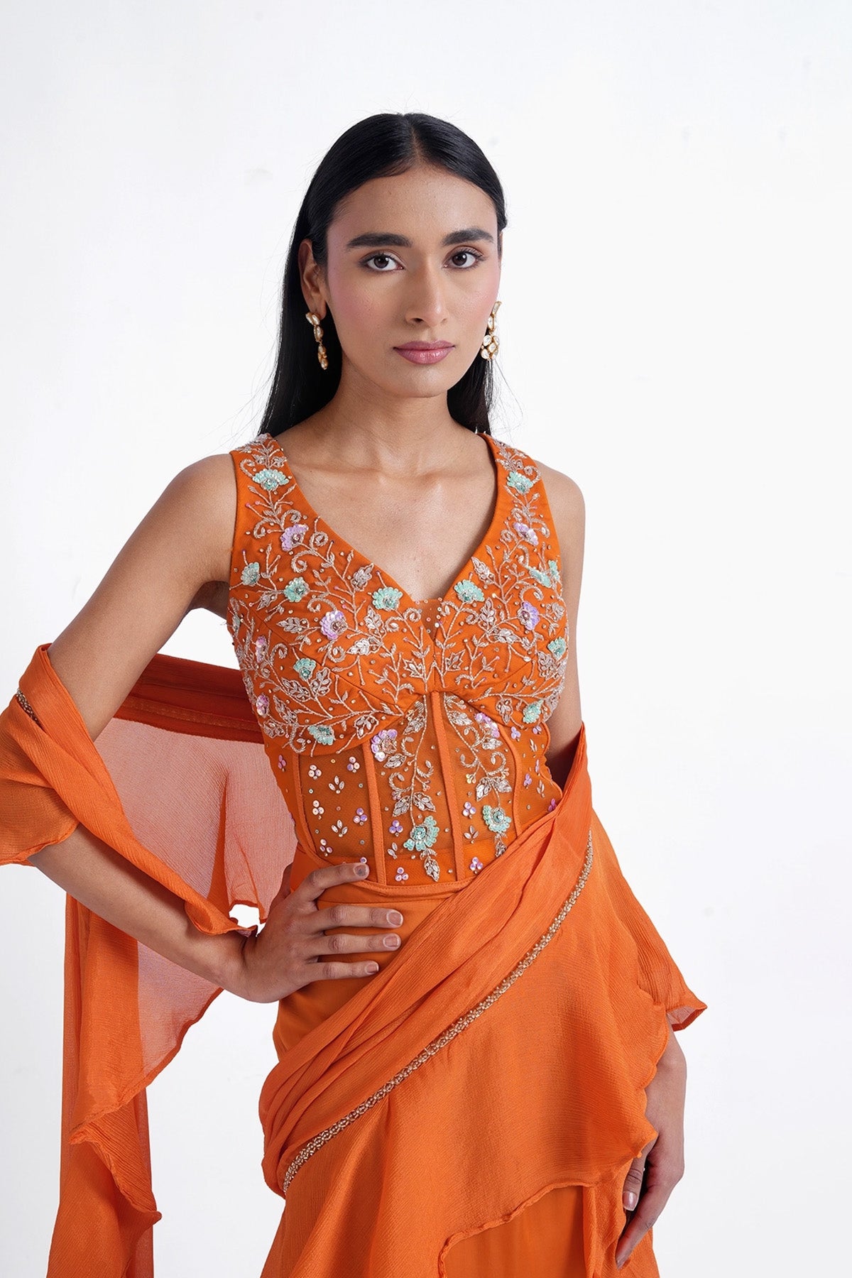 Orange fishcut saree with ruffle and corset top set