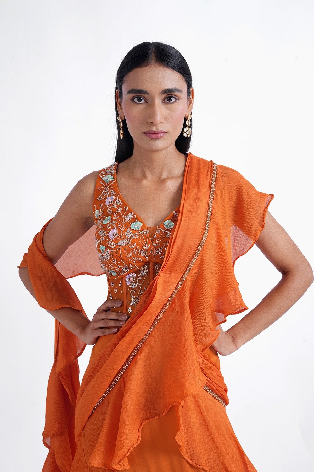 Orange fishcut saree with ruffle and corset top set