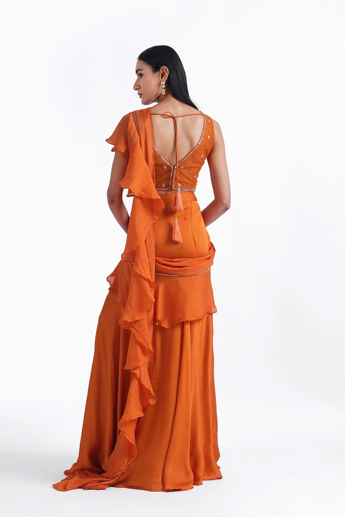 Orange fishcut saree with ruffle and corset top set