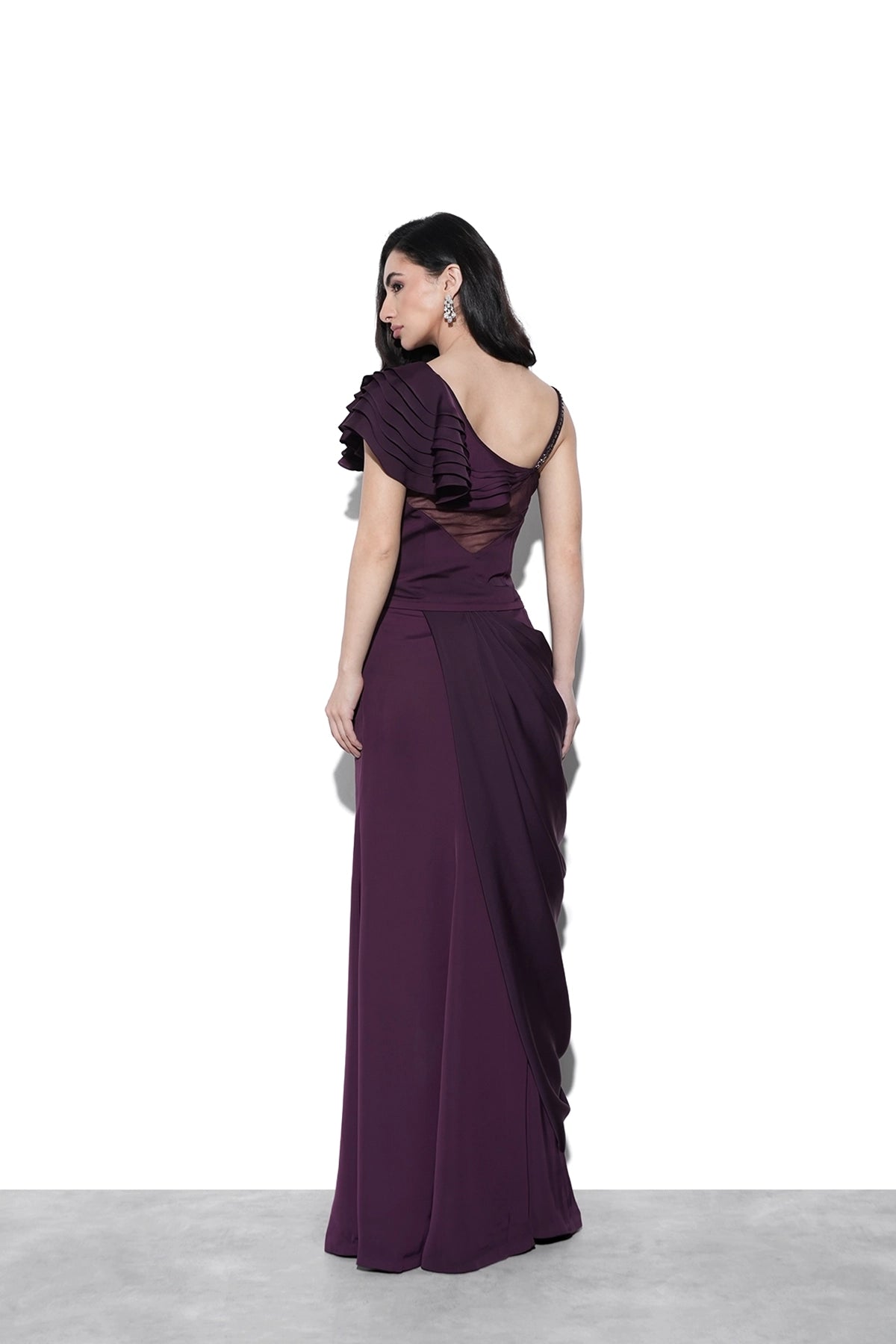 Magenta corset blouse with 3D applique and ruffles paired with draped skirt set