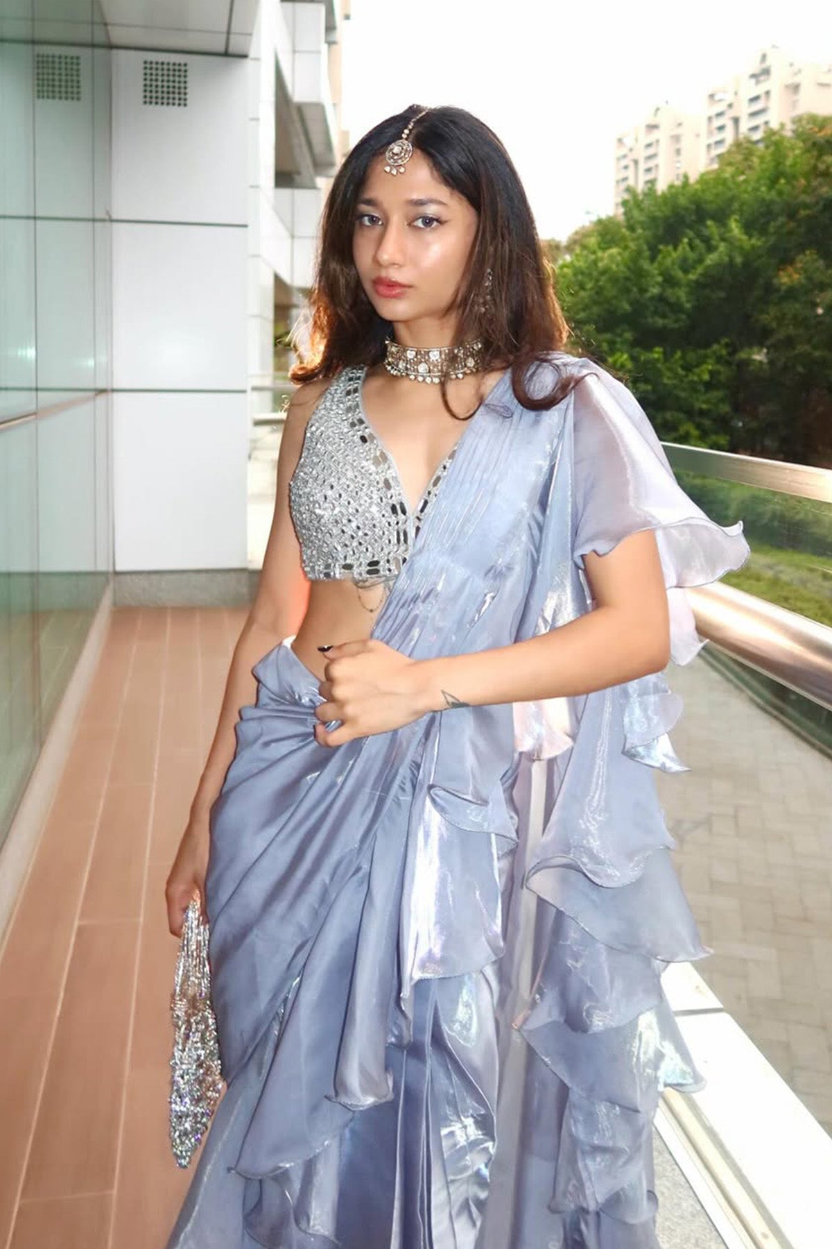 Celestial blue pre-draped saree with ruffle and mirror work blouse